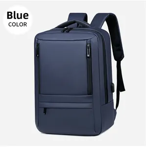 Blue business laptop backpack detail showing USB charging port and multiple zipper pockets