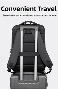 Detail of black business backpack with luggage strap fixed on silver suitcase handle