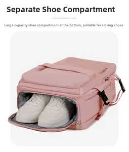 Detail view of pink travel backpack featuring a separate waterproof bottom shoe compartment