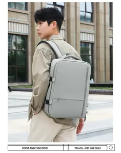 Outdoor shot of a grey minimalist travel backpack with waterproof fabric on a model