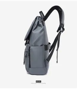 Side view of a dark grey waterproof travel backpack for men with padded straps