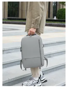 Detailed side view of light gray travel backpack with side straps on stone steps