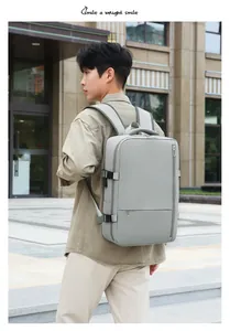 Detailed view of grey travel backpack featuring ergonomic straps and side compression buckles