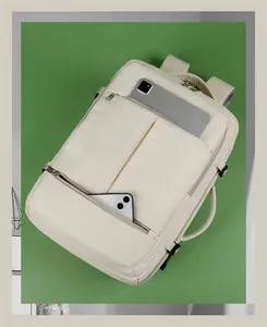 Detail of cream business backpack showing dedicated tablet and smartphone compartments