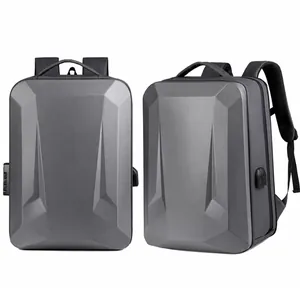 Gray hard-shell gaming laptop backpack featuring geometric design and USB charging port