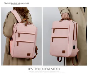 Pink waterproof laptop backpack with USB port shown in shoulder and hand-carry modes