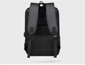 Detail of ergonomic breathable mesh back panel and luggage strap on black laptop backpack