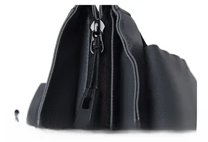 Close-up of durable metal zipper puller on high-density Oxford fabric backpack