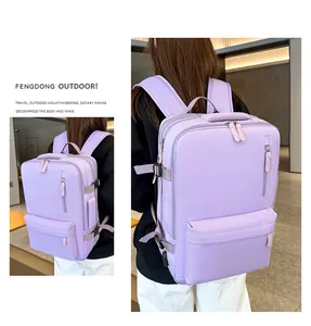 Detail view of purple waterproof travel backpack with adjustable side buckles and layered zippers
