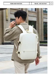 Side view of travel backpack in cream waterproof fabric on male model in urban setting