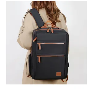 Detail of minimalist business backpack with leather accents and side pockets on beige coat