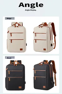 Detail view of beige and black business backpacks showing USB charging port and zipper pockets