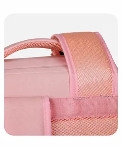 Close-up of thick padded shoulder straps with breathable mesh on pink travel backpack