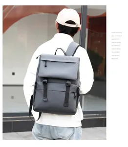 Side view of a grey waterproof travel backpack featuring buckle flap and large capacity