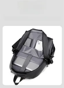 Internal view of fashion backpack showing laptop compartment and organizer pockets