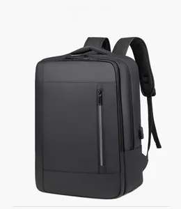 Side view of black business backpack featuring USB charging port and waterproof texture