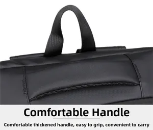 Detail of the thickened nylon handle and textured waterproof fabric of the black backpack