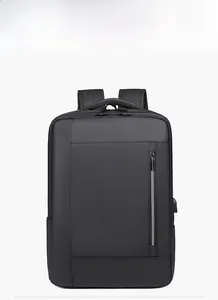 Detailed view of black business backpack with USB charging port and reflective zipper