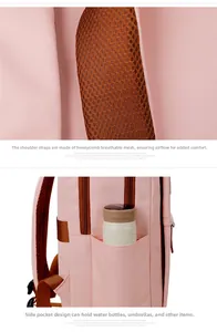 Pink backpack detail showing breathable mesh shoulder straps and a side water bottle pocket