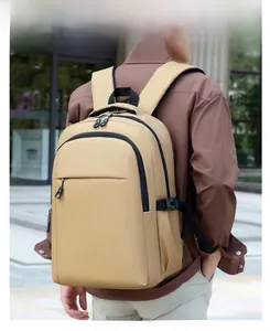 Khaki casual laptop backpack with side buckle and wide straps shown in city street