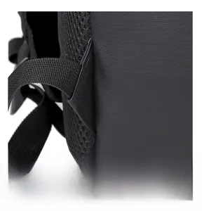 Macro detail of reinforced triangle stitching on black waterproof backpack strap