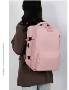 Pink travel backpack detail featuring external USB charging port and adjustable side buckles