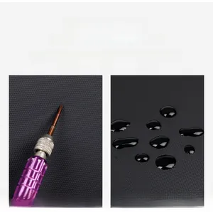 Detail of waterproof black PU leather with diamond texture and scratch-resistant test