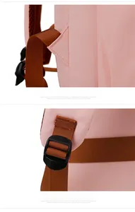 Detail of reinforced stitching and adjustable plastic buckle on the pink backpack