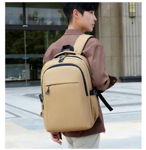 Side view of beige minimalist backpack with durable fabric and straps in outdoor setting