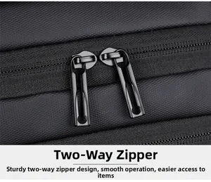 Detail of durable dual-way metal zippers on a black textured business laptop backpack