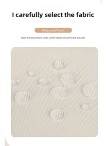 Close-up of high-density cream Oxford fabric with water-repellent droplets on surface