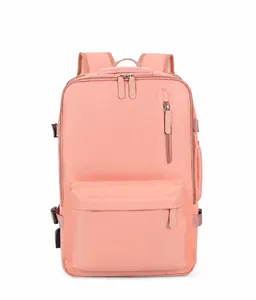 Front view of pink expandable travel backpack with multiple zippers and durable handle