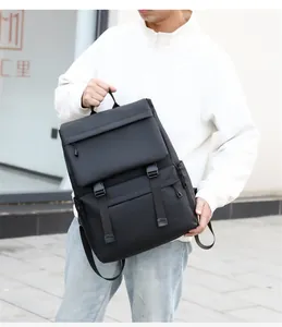 Close-up of black waterproof multi-pocket travel backpack with durable buckles and handles