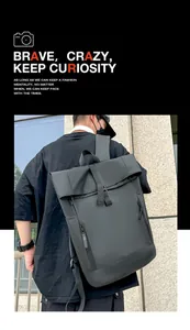 Detail of waterproof roll-top closure and adjustable strap on black commuter backpack