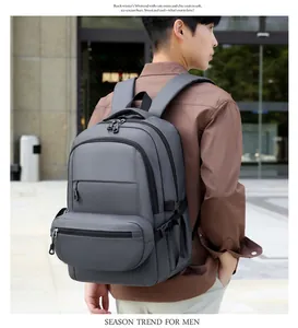 Detail of dark grey business backpack with multi-layer storage and water-resistant fabric