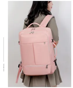 Pink large capacity backpack with multiple pockets and side handle shown on model
