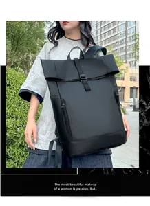 Detail of waterproof roll-top backpack featuring vertical zippers and breathable mesh straps