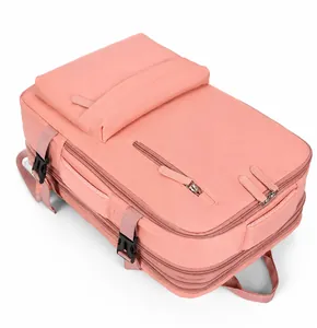 Detailed view of pink travel backpack with adjustable side buckles and waterproof fabric