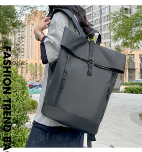 Close-up of black waterproof roll-top backpack with hidden zipper on urban street