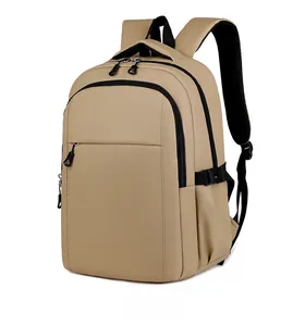 Detail view of khaki waterproof backpack with multi-layer zippers and padded straps