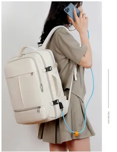 Detailed view of beige business laptop backpack with side handle and USB charging port
