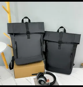 Waterproof roll-top backpacks in black and gray, featuring side pockets and adjustable straps