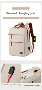 Detail of laptop backpack with external USB charging port and brown zipper accents