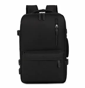 Front view of black travel backpack featuring multiple zippers and an external USB port