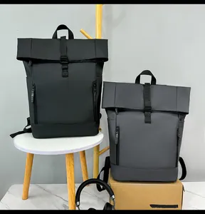 Detail of waterproof roll-top backpacks in black and grey for outdoor travel and commute
