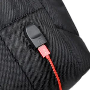 Large capacity waterproof backpack with external USB charging port and red cable
