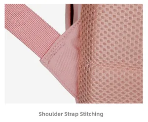 Close-up of pink backpack showing breathable mesh and reinforced bar-tack strap stitching