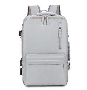 Front view of grey travel backpack showing waterproof nylon and multiple pockets
