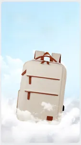 Detail of lightweight off-white commute backpack with leather handles and dual zippers