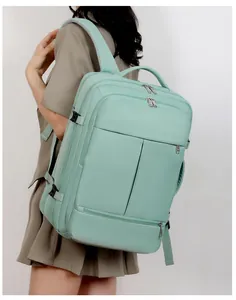 Mint green high-capacity travel backpack with ergonomic shoulder straps on a female model